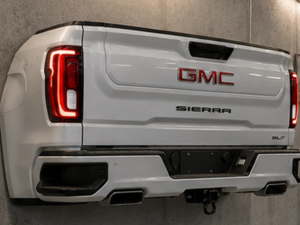 Summit S pearl white automotive wall sculpture installed on a concrete garage wall